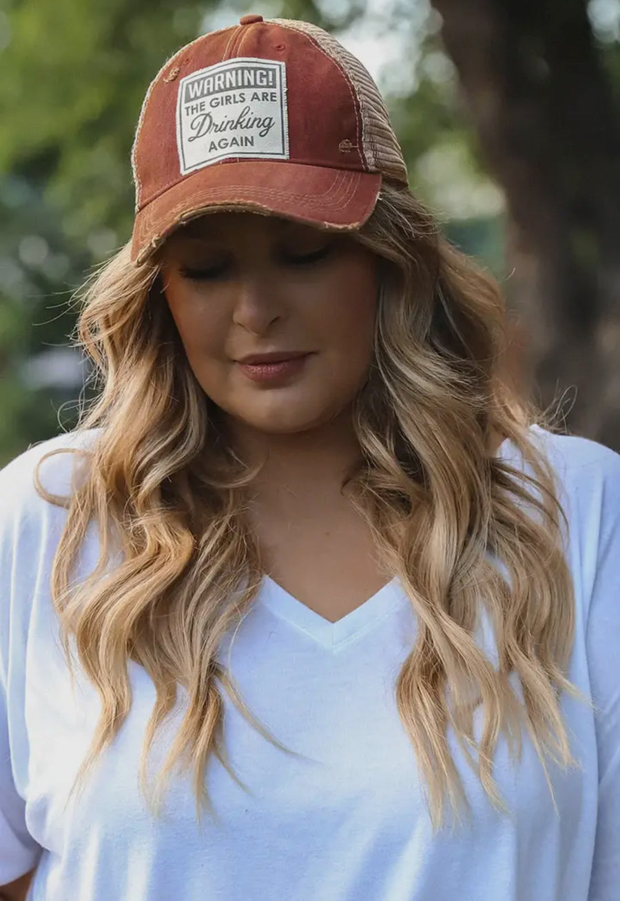 Warning the Girls are Drinking Again Distressed Trucker Hat