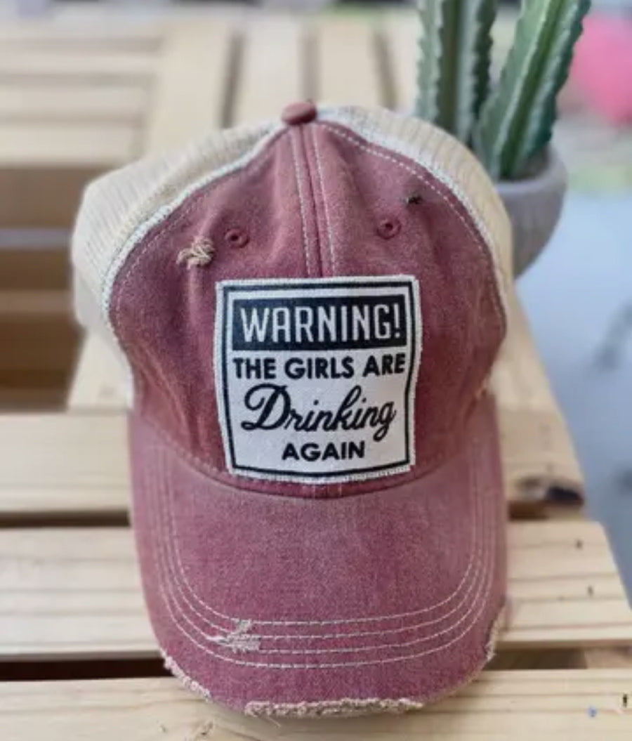 Warning the Girls are Drinking Again Distressed Trucker Hat